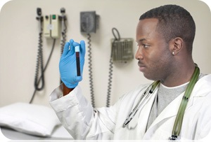 Doctor looking at a blood sample.